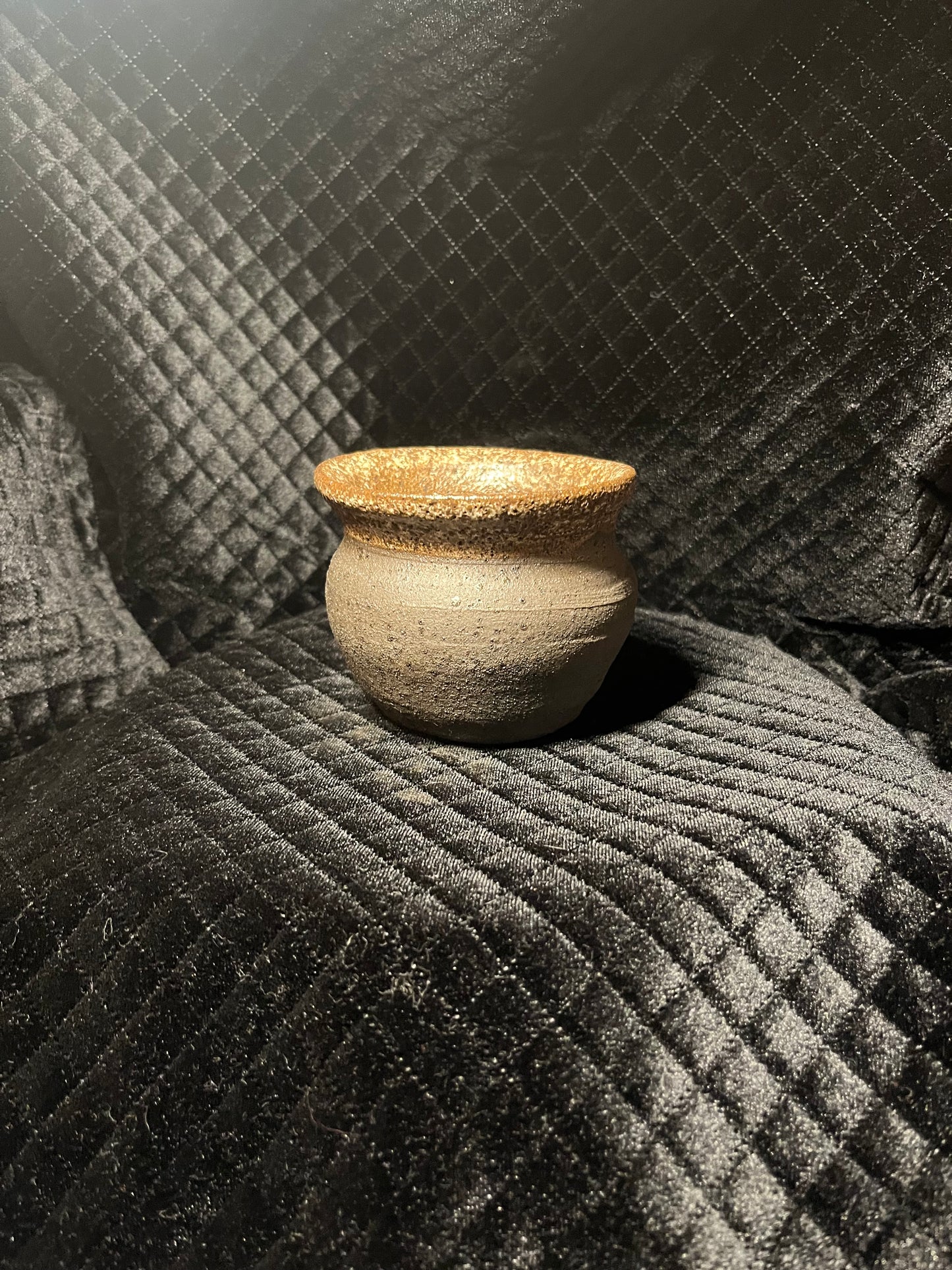 oval black clay vase