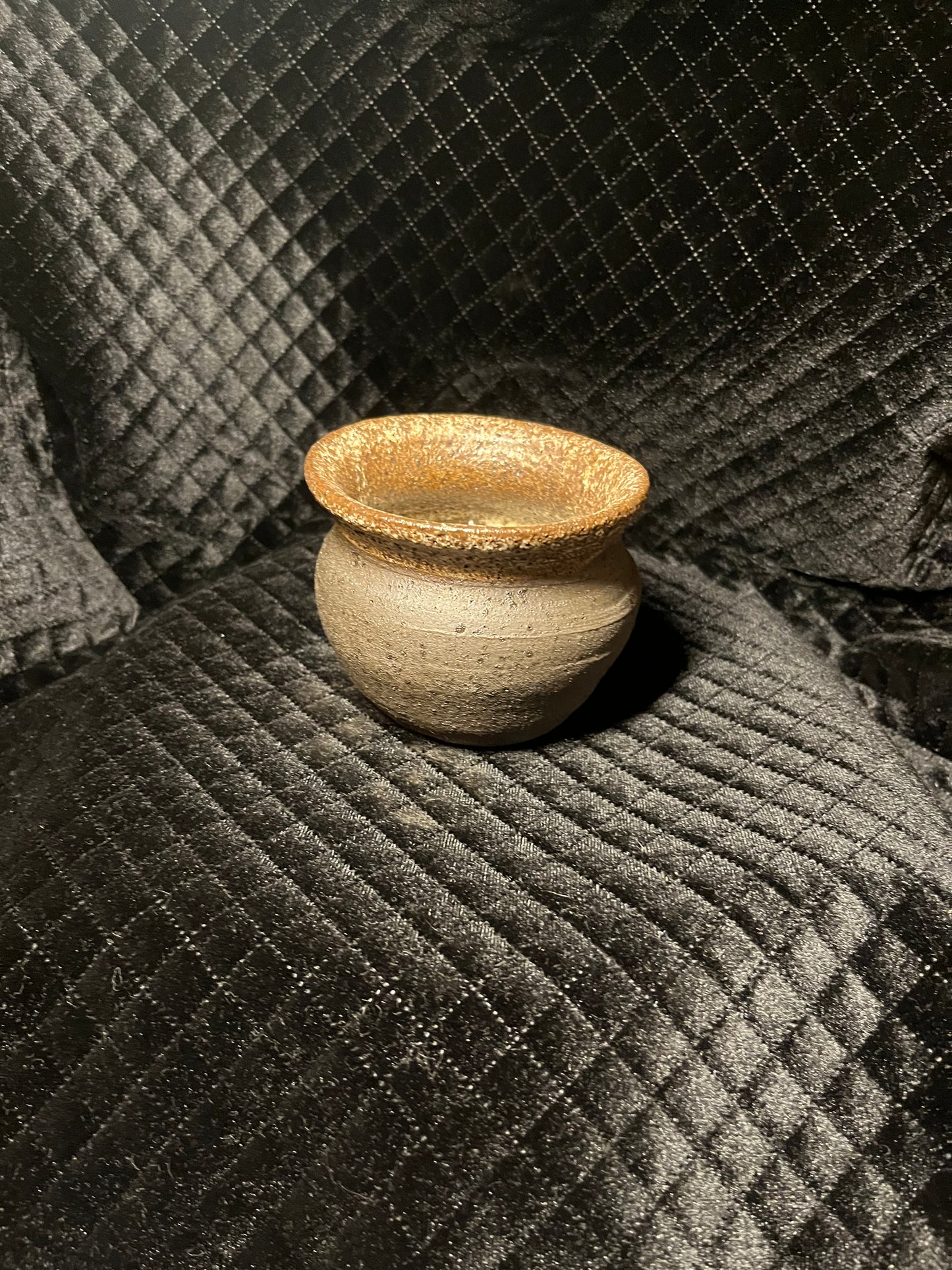 oval black clay vase
