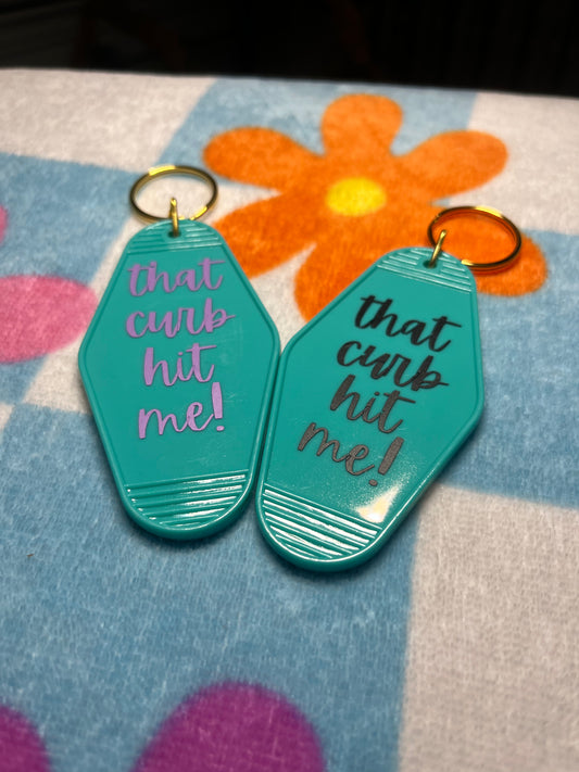 that curb hit me! motel keychain